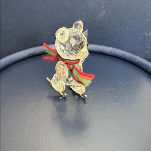 Miniature bear on ice skates